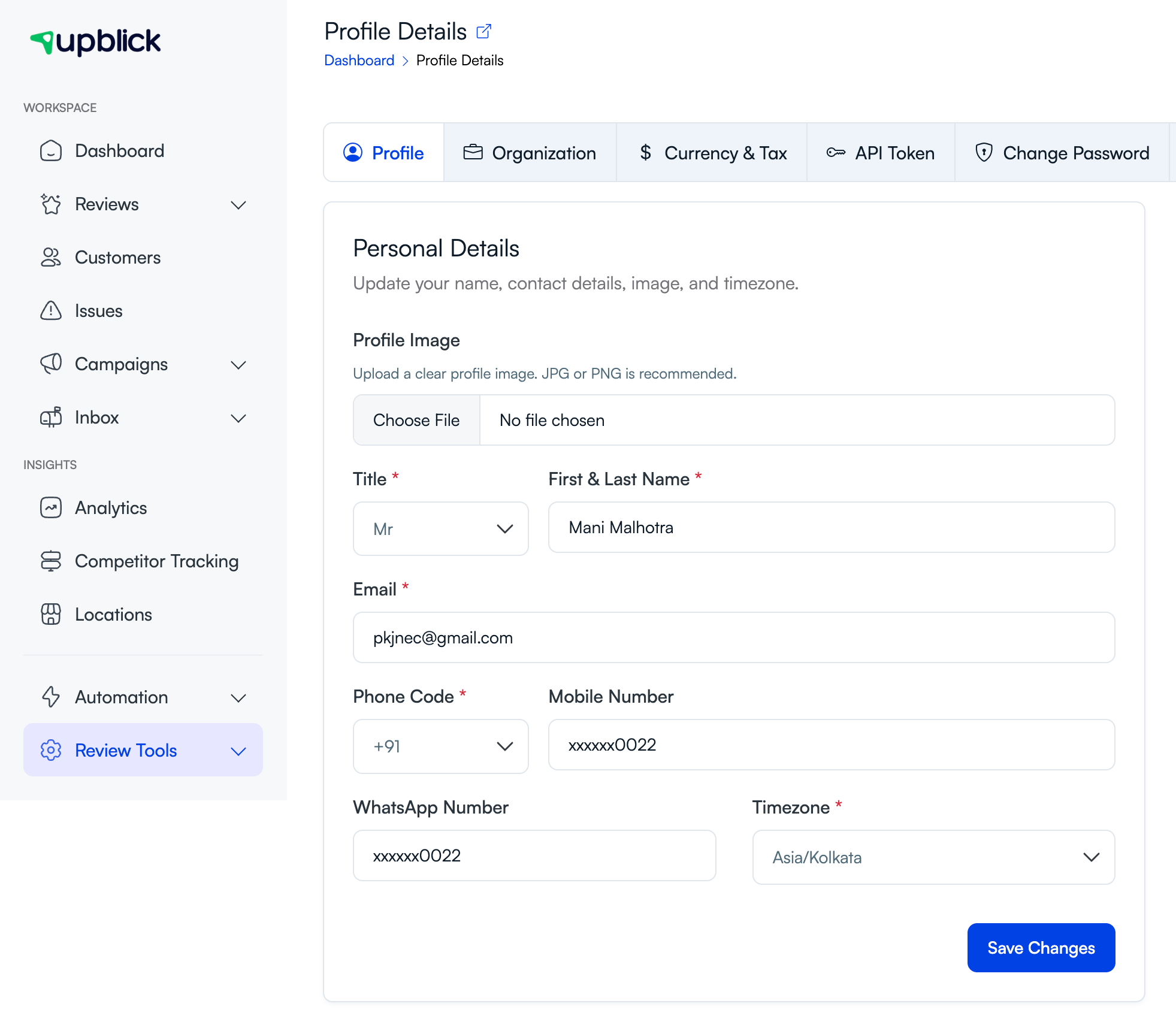 UpBlick Profile Details page showing Profile, Organization, Currency and Tax, API Token, and Change Password tabs
