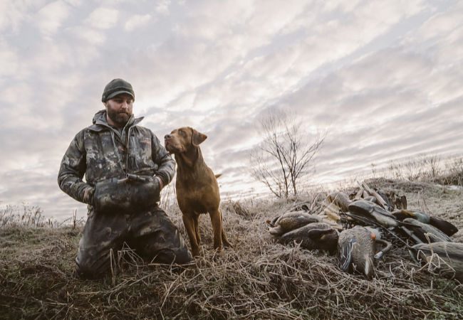 Addison Edmonds, Founder of Gunner, pictured with his English Labrador Retriever Gunner.