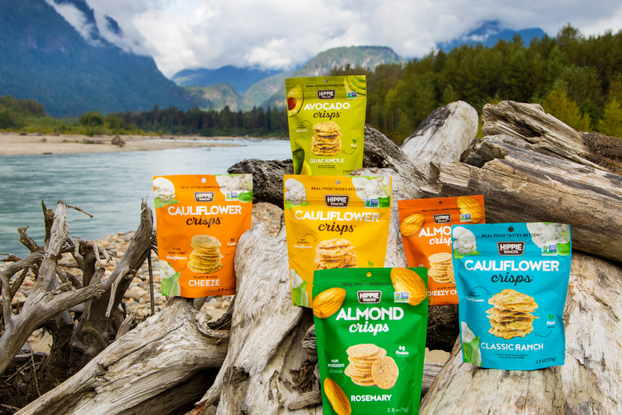 bags of crisps displayed in nature by hippie snacks