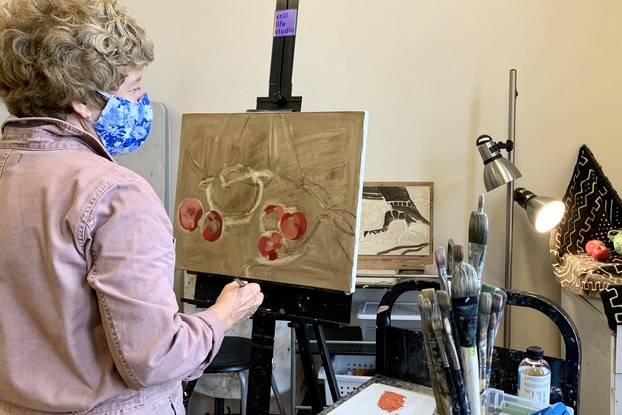 Adria Moynihan Rusk, owner of Still Life Studio, painting.