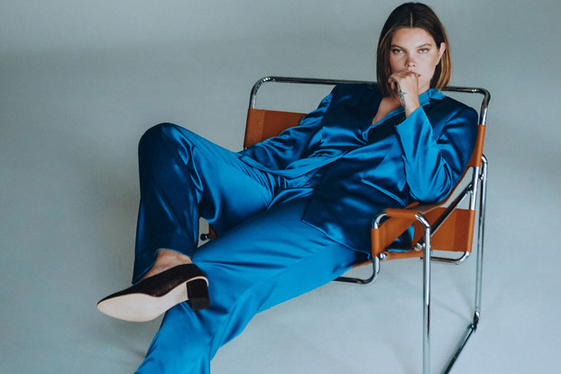 woman modeling a luxury suit from plus-size luxury fashion line, Henning.