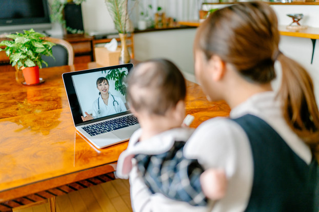 Telemedicine with doctor, mother and baby