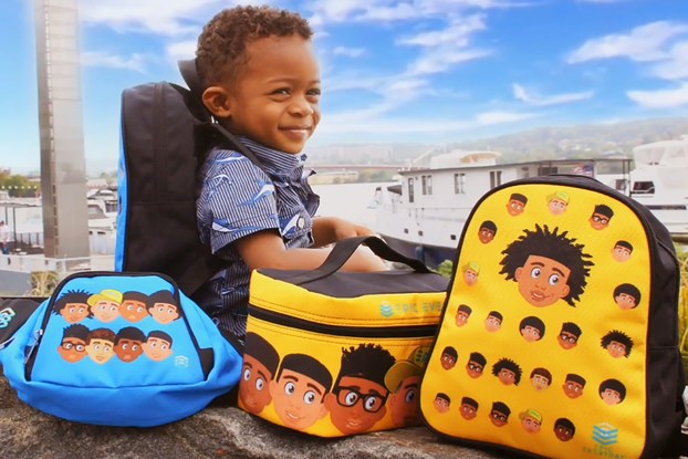 little boy sitting with backpacks and accessories created by EPIC Everyday, Inc.