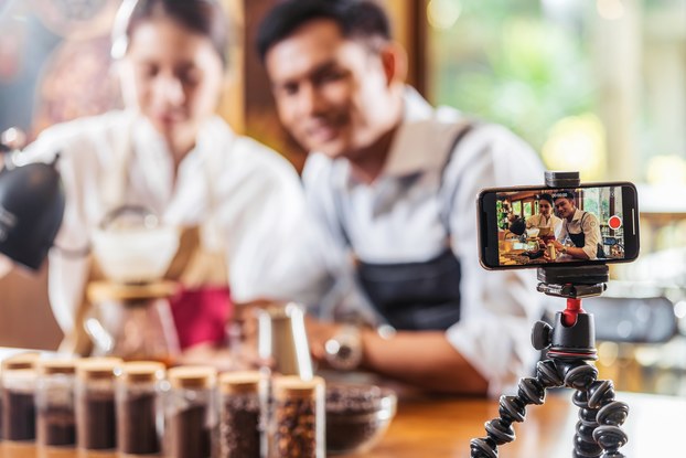 two people recording themselves on video