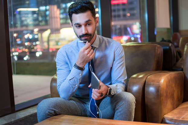 Entrepreneur takes a business call in a cafe