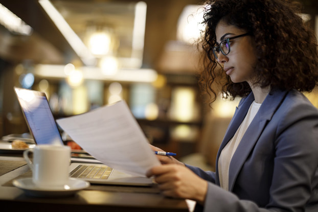 Entrepreneur does paperwork in a cafe