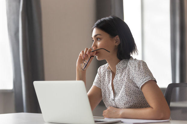 Woman considers options of a business decision