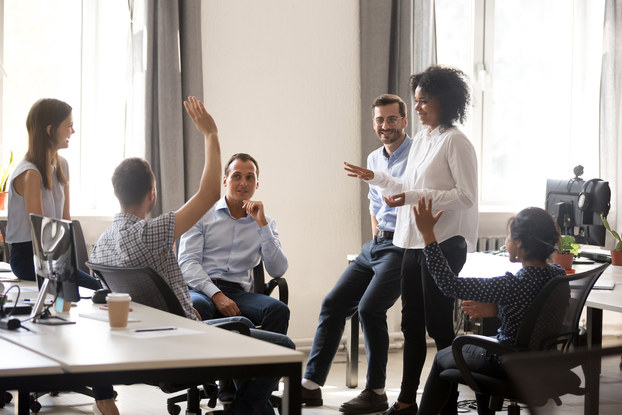 Team of employees together in a meeting.