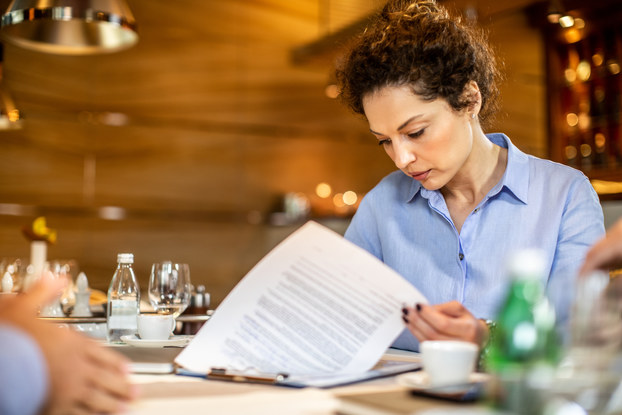 Woman entrepreneur reviews paperwork