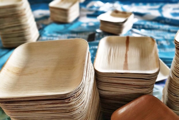 Display of Karmic Seed tableware stacked on a table.
