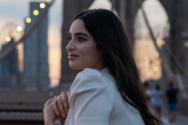 Ines Belakhdar, founder of Bynes New York, posting on the Brooklyn Bridge.