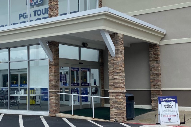 PGA TOUR Superstore store exterior showing its new "Curbside Caddie" drive-up space for order pickup.