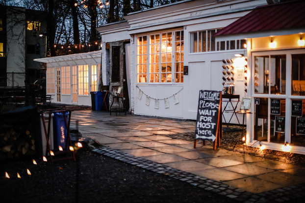 The Argos Inn outdoor bar at night with bistro lighting.