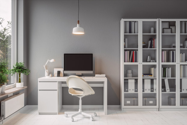 Modern home office with white furniture.
