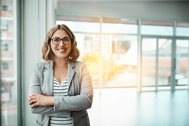  Portrait of a confident businesswoman in front of an office 