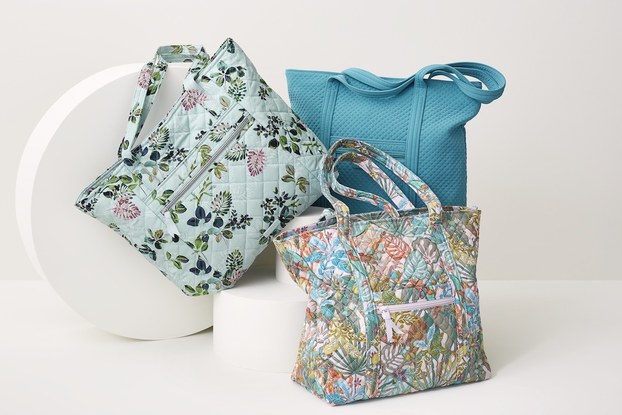 Product display of floral bags by Vera Bradley.