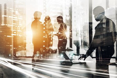 Futuristic view of employees in an office in a metropolitan area.