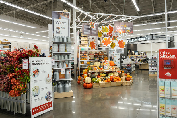 Interior of Michaels showing a fall-themed floral and decor display.