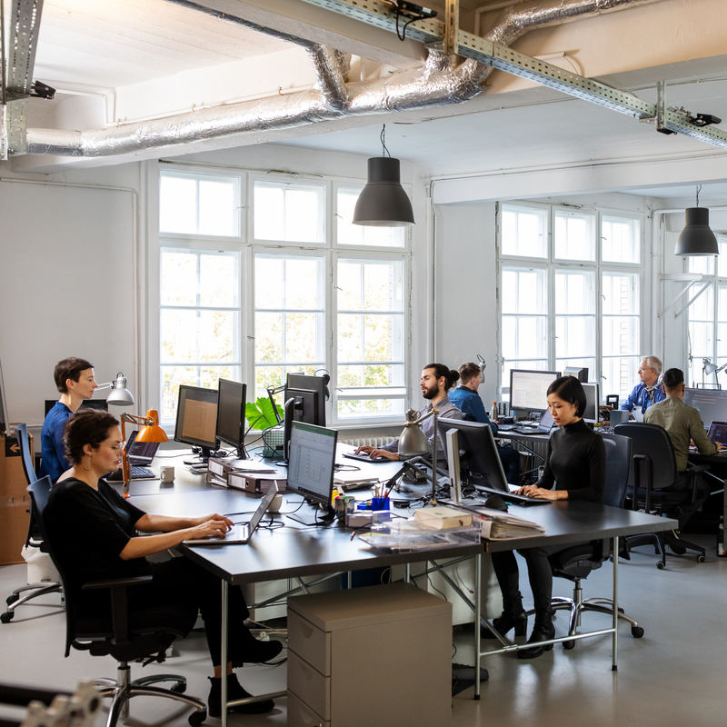 Busy modern open plan office with staff.