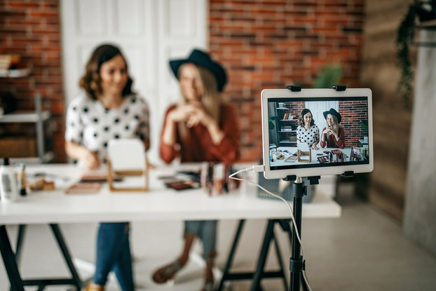 Two business owners conduct virtual event about products