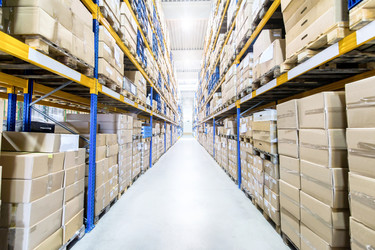  Large and modern warehouse with boxed products 