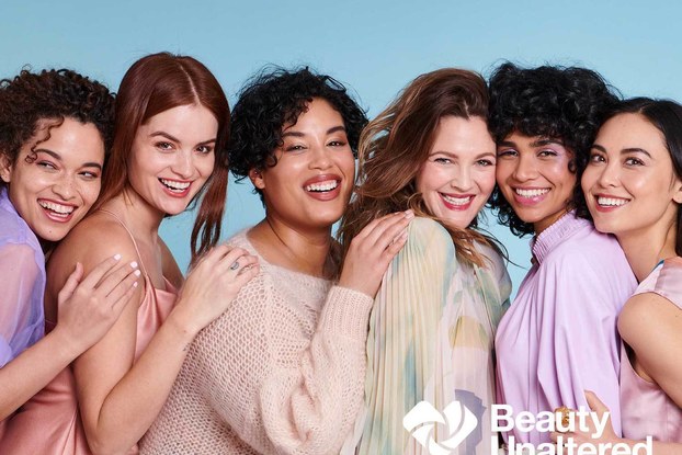 Models posing and smiling for the Beauty Unaltered campaign.