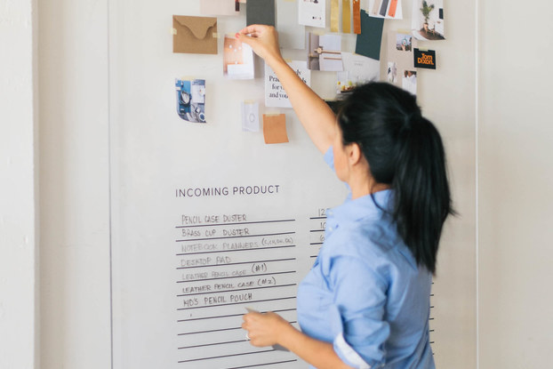 Woman looks at bulletin board