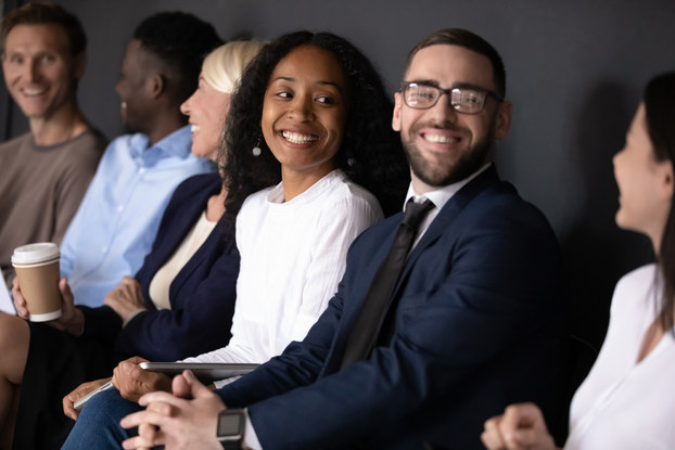 Motivated job applicants communicating before interview