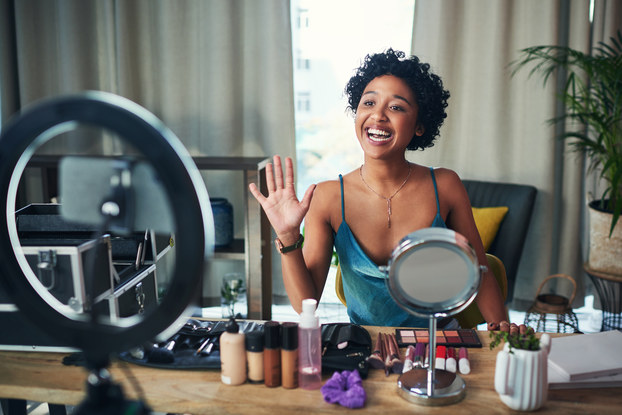 An entrepreneur recording a video for her business.