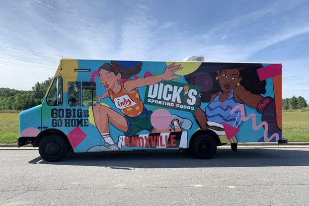 Truck showing Dick's Sporting Goods female empowerment campaign.