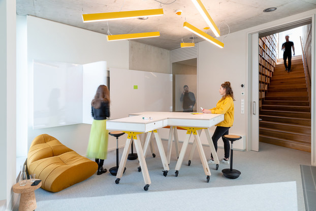 Interior of Alcon Lighting, with a desk and employees.