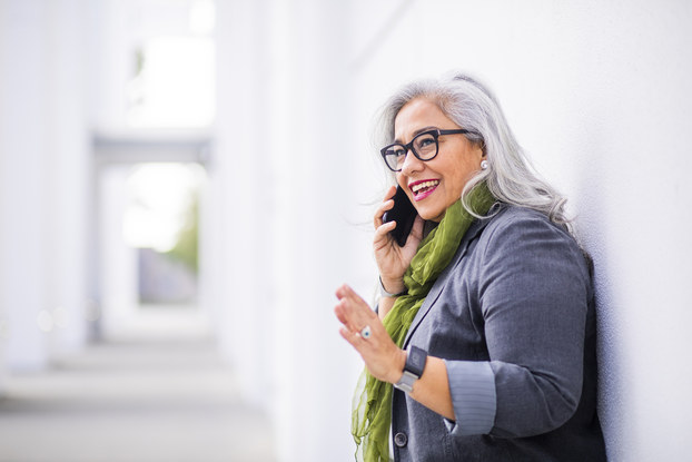 Senior hispanic businesswoman on the phone
