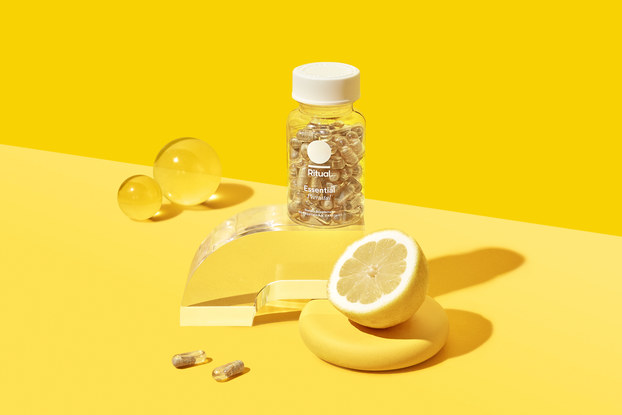product display of ritual vitamins with yellow backgound