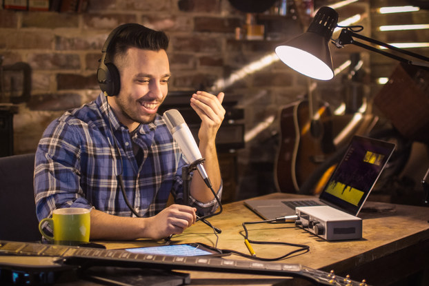 man recording podcast at home