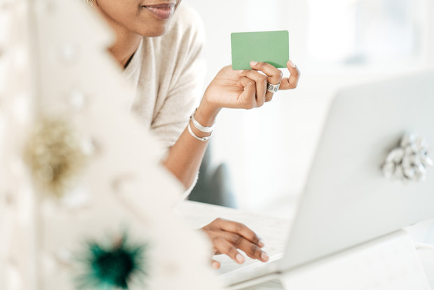woman shopping online with card