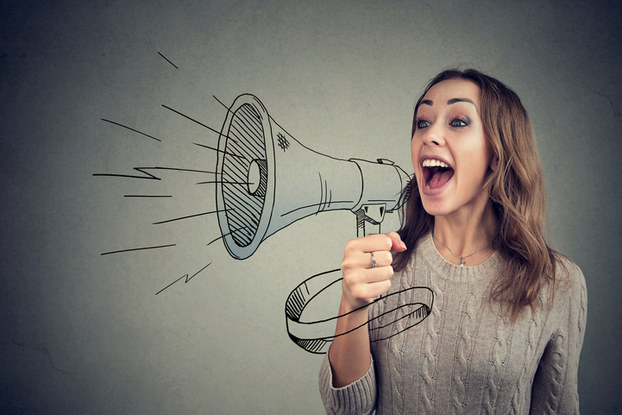Woman yelling through bullhorn