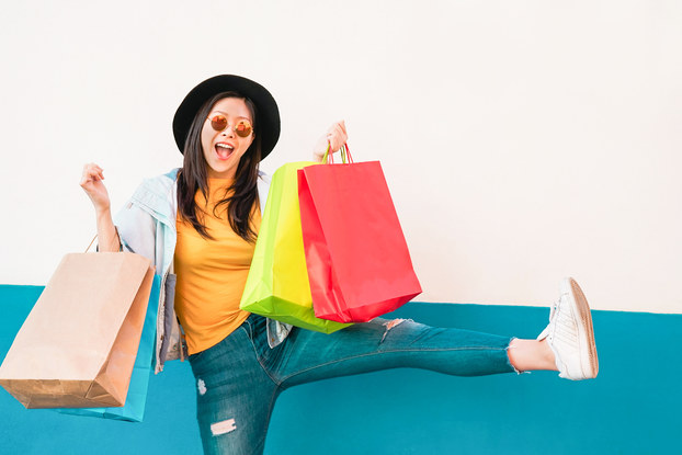 happy woman holding shopping bags