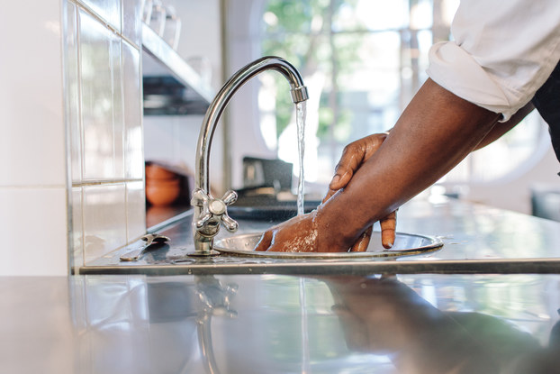 restaurant worker washing hands