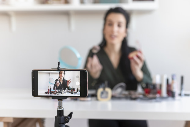 woman live streaming makeup