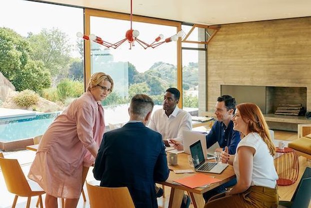 coworkers having a meeting in a house