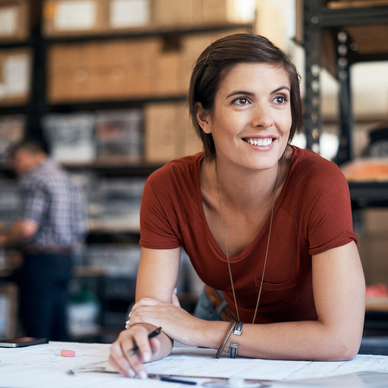 woman smiling over paperwork