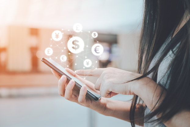person holding phone with dollar signs