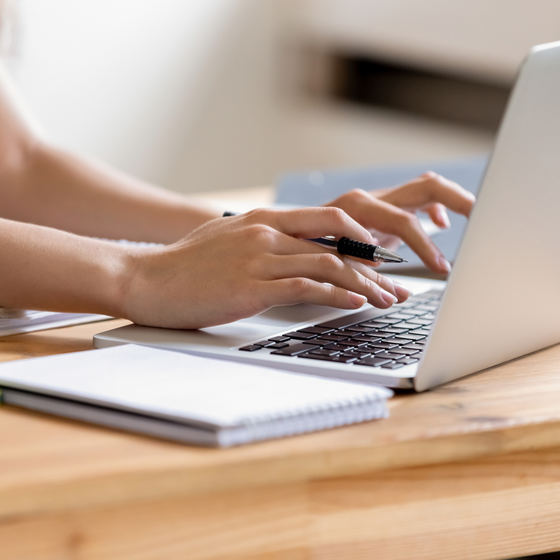 person typing on laptop