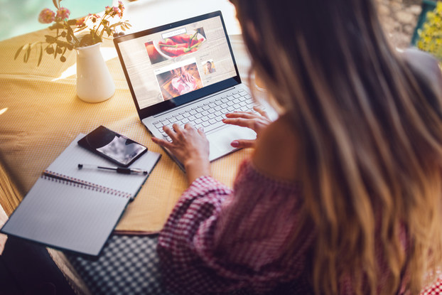 girl sitting at desk on laptop