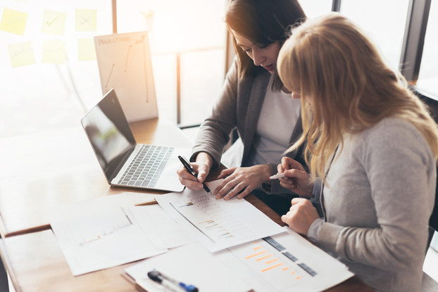 two women going over paperwork