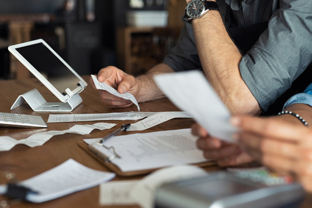 business owners going through receipts and paperwork