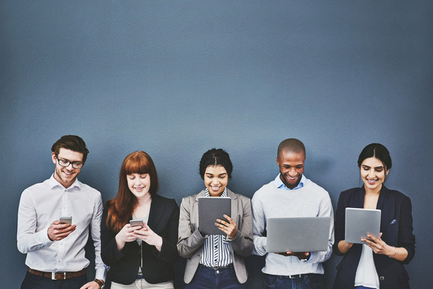 group of people standing in a line on mobile devices