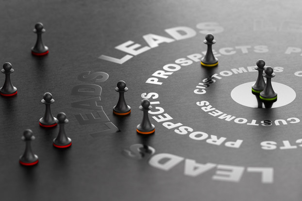 chess pieces on a table with words about prospects and leads