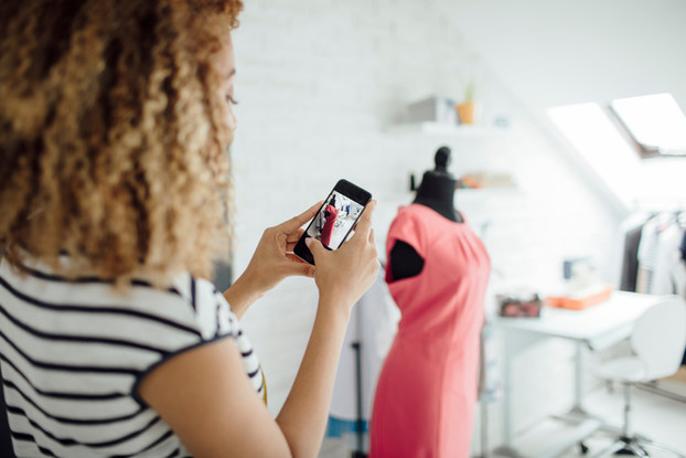 woman taking a photo of her tailored dress