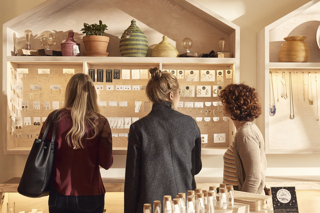 women looking at products in faire ad